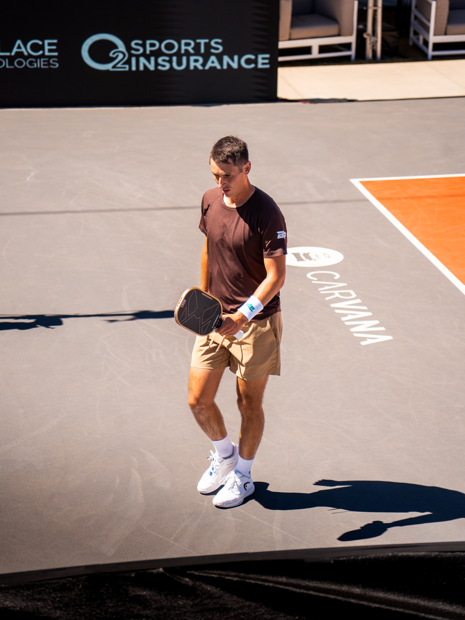 Ivan Jakovljevic walking alone on court.