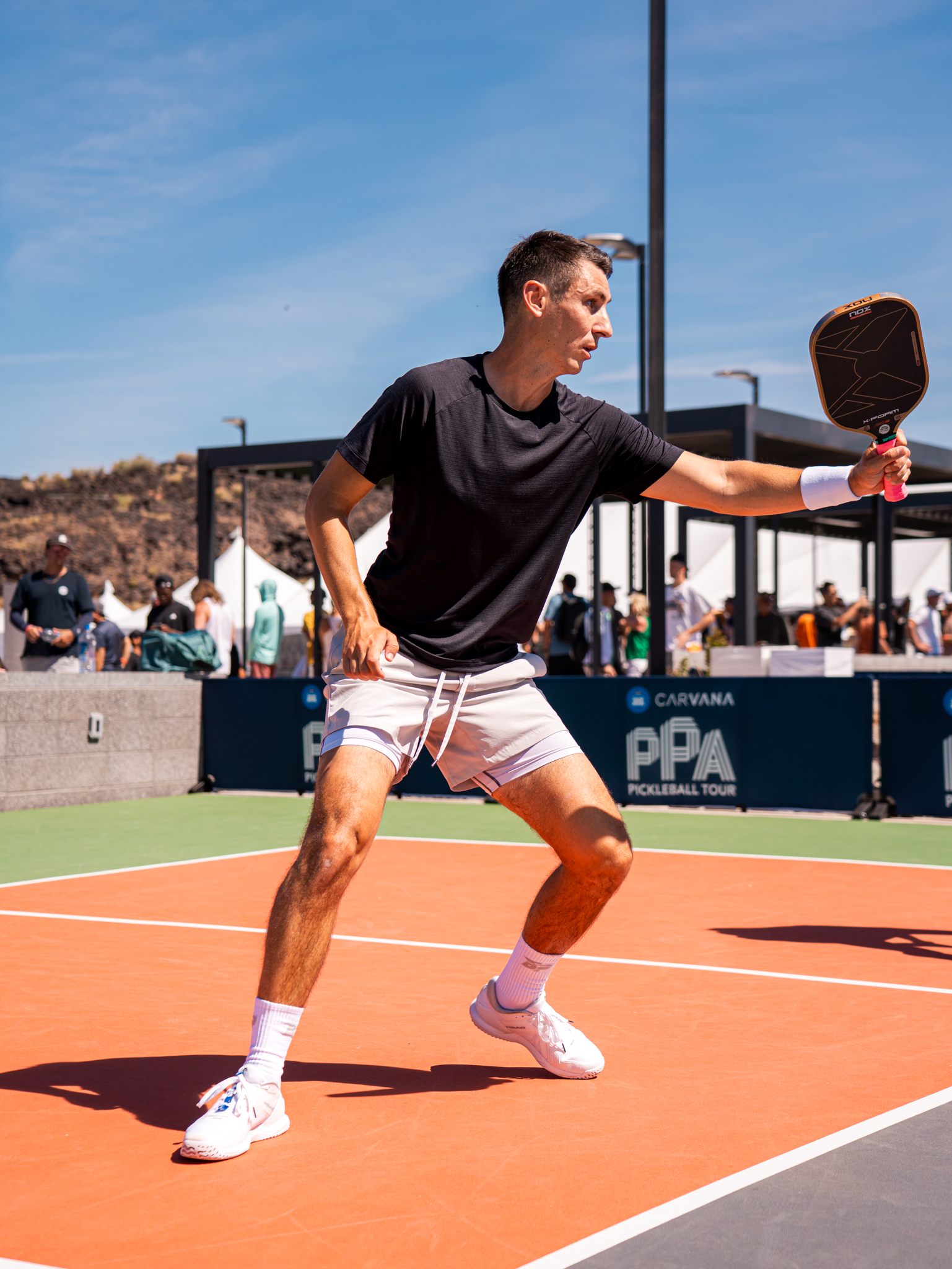 Ivan Jakovljevic in a solo ready position on court.